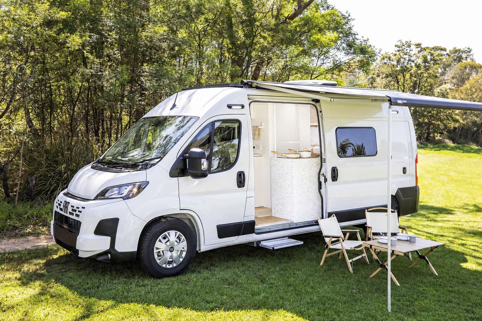 Avalon set up outdoors with awning out and camp chairs